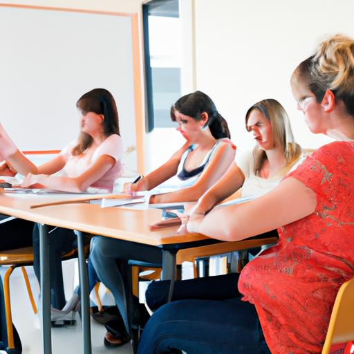 Phòng học với những học sinh nữ ngồi tại bàn và lắng nghe giáo viên nữ giảng bài